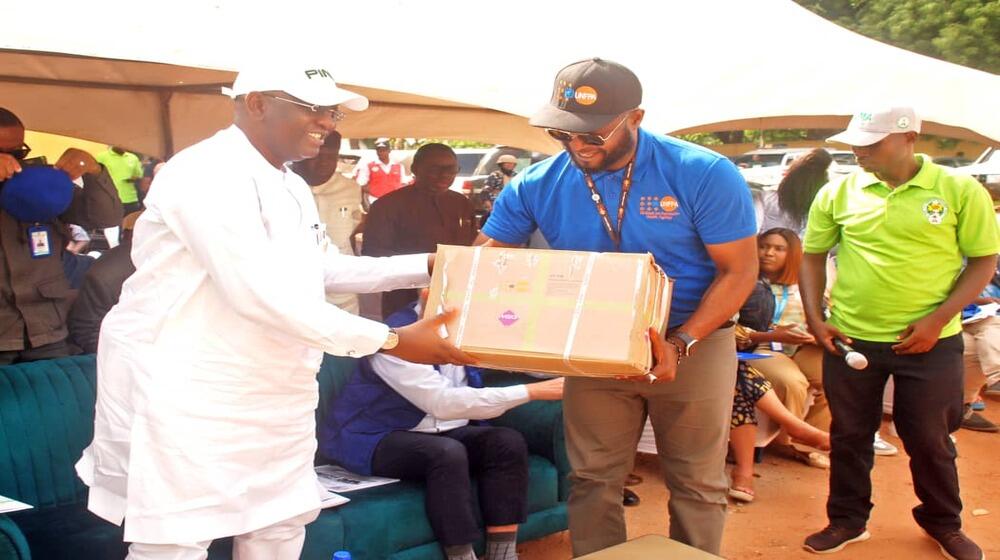 Deputy Governor of the state; H.E. Bar. Dr. Sam Ode receiving items from UNFPA Nigeria Humanitarian Coordinator Chris Sabum